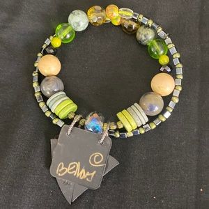 FUNKY BRACELET that is flexible on your wrist.  Wood & glass beads.